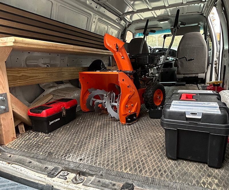 Mower Masters technician performing on-site repair